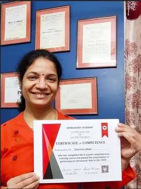 Doctor holding Gynecology Academy course completion certificate